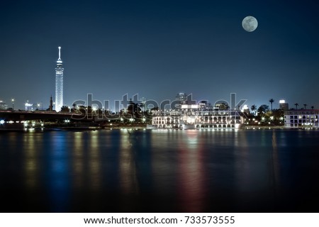 Cairo skyline at night with full moon in the scene