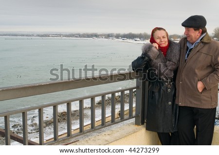 Elderly loving couple in the winter during rest.