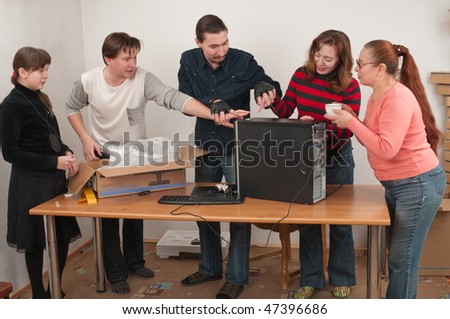 All family was gathered to look at the new computer.