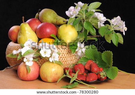 Blossoming branches of an apple-tree and pear, and also their fruits and strawberry.