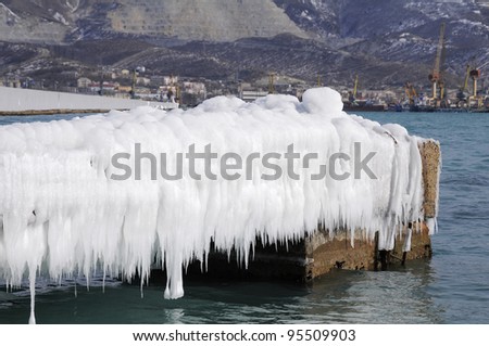 During a whole gale on Black sea splashes flied on 50-100 meters, therefore all quay has iced over, has become covered by a thick ice layer.The city of Novorossisk, southern Russia.