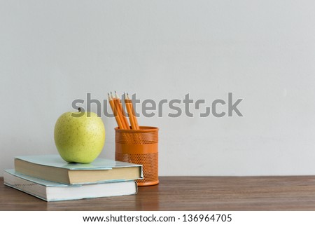 An apple and book