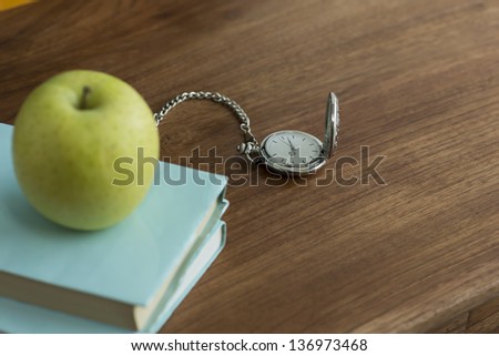 An apple and book