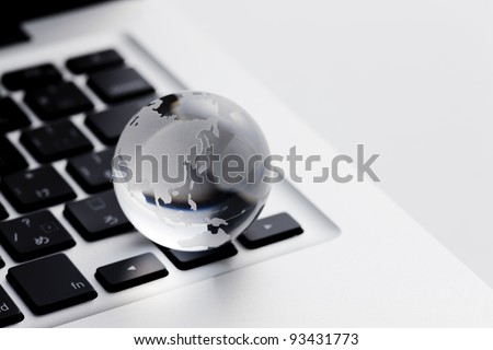 A terrestrial globe and PC