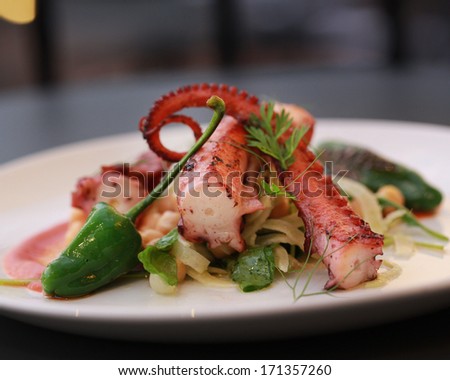Griddled octopus with charred corn. fennel and pickled pepper sauce
