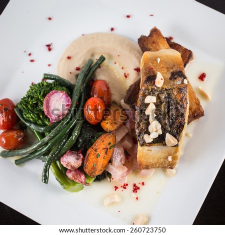 Roasted Bass, White Bean Puree, Roasted Vegetables and Radish with Shishito Peppers and Pork Belly with Brown Butter and Almonds