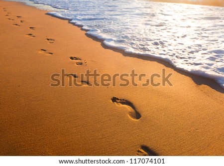 Beach, Wave And Footsteps At Sunset Time