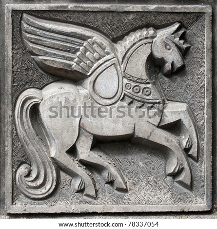 old bas-relief of fairytale fantasy winged horse on the wall