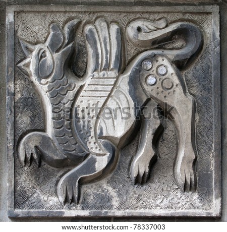 old bas-relief of fairytale fantasy wolf on the wall