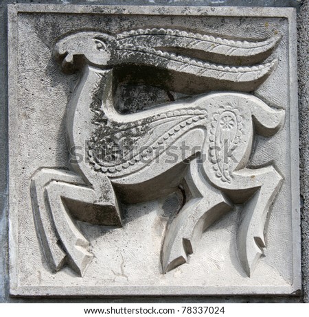 old bas-relief of fairytale fantasy deer on the wall