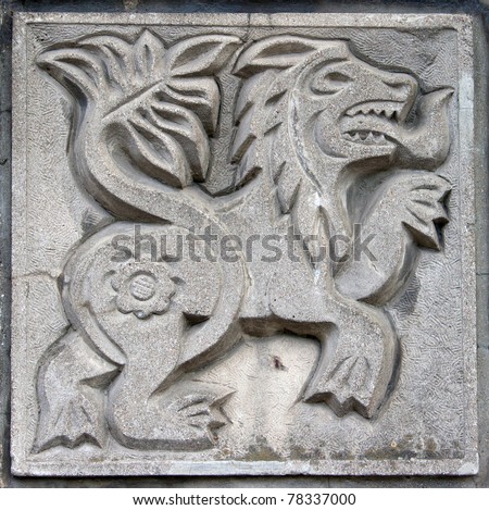 old bas-relief of fairytale fantasy lion on the wall