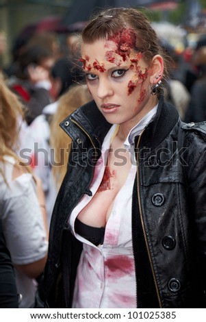 MOSCOW - MAY 14: Unidentified made-up female participant with fragments of broken glass on her face at Zombie Walk on Old Arbat, May 14, 2011, Moscow, Russia.