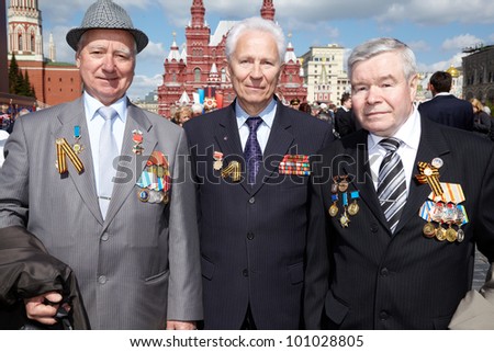 MOSCOW - MAY 9: Veterans of Labor B.Panteleevich, V.Leontievich, S. Fiodorovich on Victory Day celebration on Red Square, May 9, 2011, Moscow, Russia. Veterans are awarded with labour decorations.