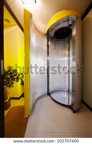 Open tanning booth in beauty salon.