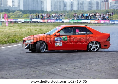 MOSCOW - JUNE 11: Red racing car with pilot D.Kharchenko rides on the track of Moscow racetrack MegaFon Tushino Ring  at Megafon mitjet race, June 11, 2011, Moscow, Russia.