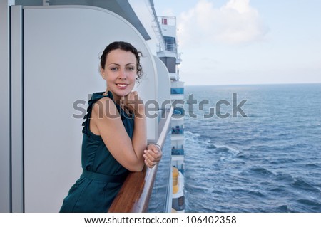 young smiling woman traveling on ship