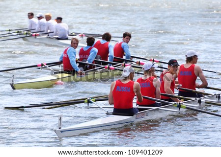 MOSCOW  - JUNE 5: Three boats with four men teams rowing at Great Moscow Regatta 2011 on June 5, 2011 in Moscow, Russia.