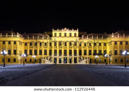 Facade of Schonbrunn Palace at dark winter night in Vienna, Austria.