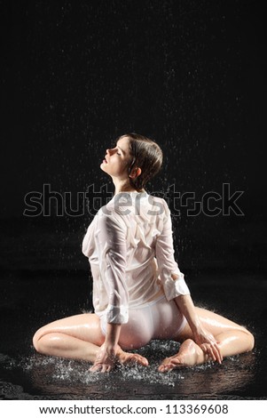 Wet sexy underwear girl seat on floor under water, back