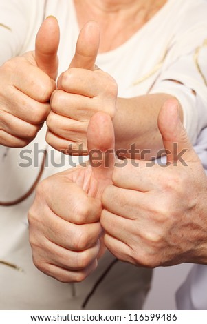 senior couple show big finger, good gesture