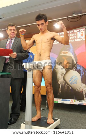 MOSCOW - JAN 12: Weighing underwear boxer on press conference of World Series of Boxing between Dynamo Moscow-Bangkok Elephants in Press Center RTR on Jan 12, 2012 in Moscow, Russia.