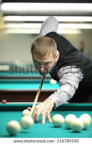 MOSCOW-JAN 21:Unidentified participant of Moscow championship billiard takes part in competition at a snooker center SC in Olimpiysky, Jan 21, 2012 Moscow, Russia.15 participants took part.