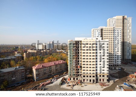 MOSCOW - OCTOBER 7: Three buildings under construction of residential complex Elk Island on October 7, 2011 in Moscow, Russia. New residential complex Elk Island is being built near to national park.