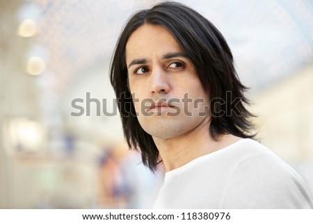Portrait of dark-haired brown-eyed man