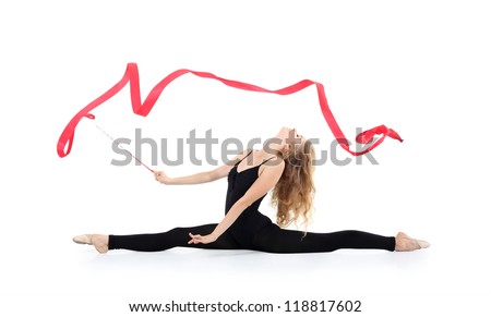 Beautiful ballerina in black suit sits on twine throwing her head with red ribbon isolated on white background.