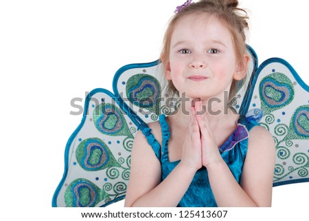 Half-length portrait of little girl in fancy dress with hands put prayerfully