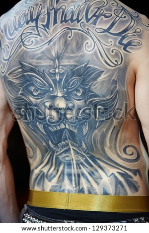 MOSCOW - MAY 20: Tattooed male back at V Moscow International Tattoo Convention 2012 in club ARENA-MOSCOW, May 20, 2012, Moscow, Russia. Convention was organized by Tattoo Studio Angel.