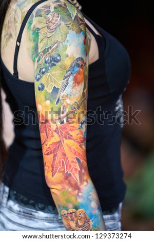 MOSCOW - MAY 20: Tattooed female arm at V Moscow International Tattoo Convention 2012 in club ARENA-MOSCOW, May 20, 2012, Moscow, Russia. Convention was organized by Tattoo Studio Angel.