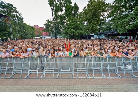 MOSCOW - JUN 23: People listen to concert of Chaif rock-band during VII traditional festival of live sound Music of Summer in Hermitage Garden, Jun 23, 2012, Moscow, Russia.