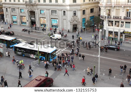 MADRID - MARCH 8: Pedestrians walk at Gran Via street on March 8 2012 in Madrid, Spain. In late 1930s, modern Gran Via while called Avenida de Rusia.