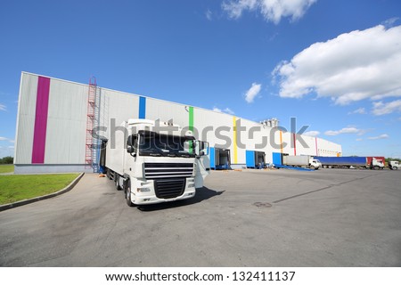 MOSCOW - JUNE 5: Trucks stand near warehouse of Caparol factory on June 5, 2012 in Moscow, Russia. Caparol company has 10 branches in Russia.