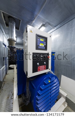 Modern powerful diesel generator for backup power with automatic switching.