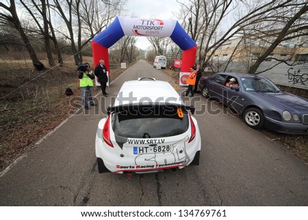 MOSCOW - APR 21: The operator records the racing car finishes  on Rally Masters Show, on April 21, 2012 in Moscow, Russia