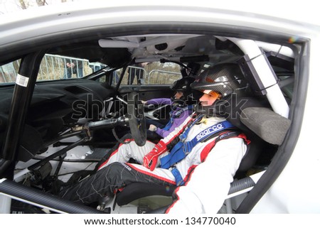 MOSCOW - APR 21: The crew of a sports car in white coveralls on Rally Masters Show, on April 21, 2012 in Moscow, Russia