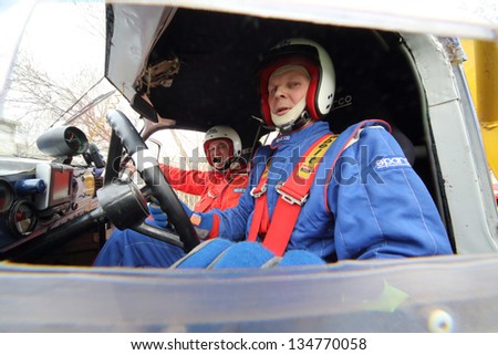 MOSCOW - APR 21: The crew of a sports car in blue coveralls on Rally Masters Show, on April 21, 2012 in Moscow, Russia