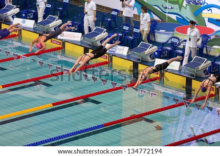 MOSCOW - APR 20: Athletes dive into the pool in Olympic Sports complex on Championship of Russia on swimming, on April 20, 2012 in Moscow, Russia
