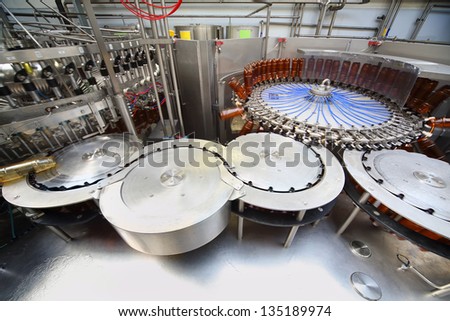MOSCOW - MAY 16: Beer bottles ready for filling in Ochakovo factory, on May 16, 2012 in Moscow, Russia. Ochakovo was founded in 1978.