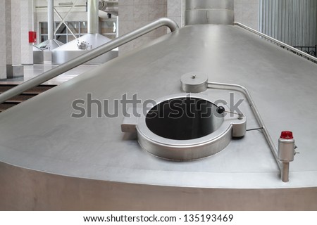 MOSCOW - MAY 31: Big cistern with hatch for beer in Ochakovo factory, on May 31, 2012 in Moscow, Russia. Ochakovo company has 18 enterprises.