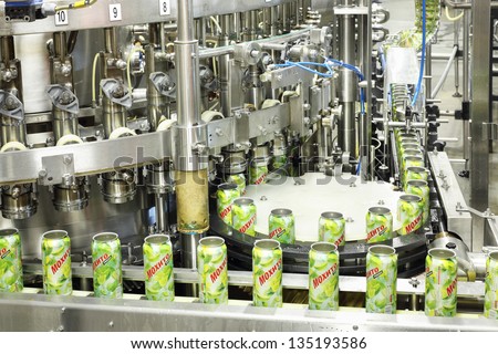 MOSCOW - MAY 16: Cans mojitos on conveyor in Ochakovo factory, on May 16, 2012 in Moscow, Russia. Ochakovo has breweries in several Russian cities - Moscow, Krasnodar, Tyumen, Penza.