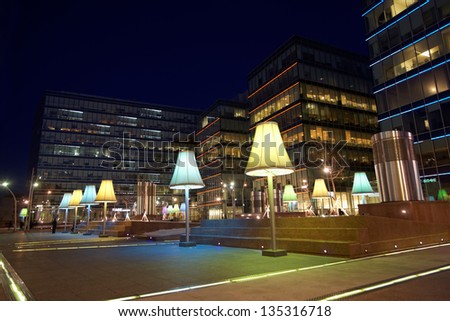 MOSCOW - MAR 24: Night square illuminated by lanterns near to Metropolis shopping center, March 24, 2012, Moscow, Russia. Metropolis - the largest shopping and entertainment center of Moscow.