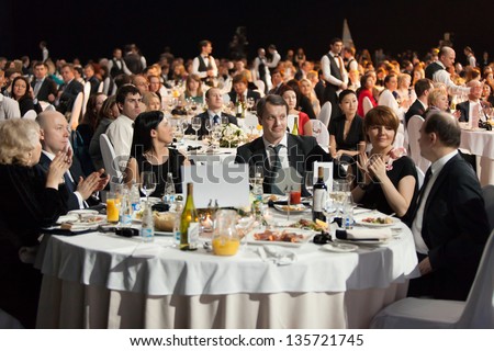 MOSCOW - APR 12: People sitting at the tables during Ceremony of rewarding of winners of an award Brand of year of EFFIE 2011, on April 12, 2012 in Moscow, Russia