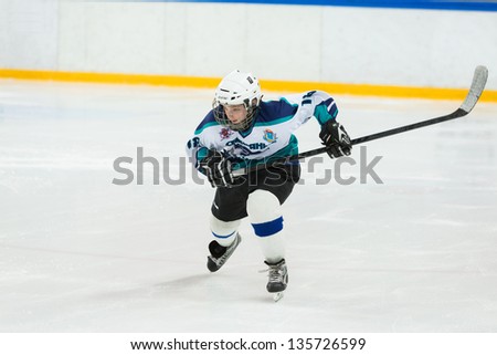 MOSCOW - APR 28: Young player on the ice on closing ceremony of the championship season of 2011-2012 Ice Hockey for Sports School, junior teams on April 28, 2012  in Sokolniki, Moscow, Russia.