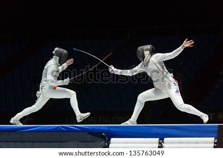 MOSCOW - APR 6: Interesting fight on championship of world in fencing among juniors and cadets, in Sports Olympic complex, on April 6, 2012 in Moscow, Russia