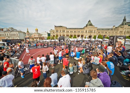 MOSCOW - MAY 27: People watch basketball game during Dudu Streetbasket fest on Red Square, May 27, 2012, Moscow, Russia. Streetbasket fest takes place within 8th sports forum GTO.