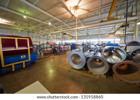 LOBNYA - JUN 7: Metal coils in manufacturing workshop at plant of Group of companies Metal Profile, June 7, 2012, Lobnya, Russia. Structure of Group of companies Metal Profile includes 12 plants.