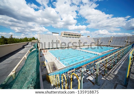 MOSCOW - JUN 30: People in open pool of sports complex Luzhniki, June 22, 2012, Moscow, Russia. Equipping of pool includes five baths: two open and three closed type.